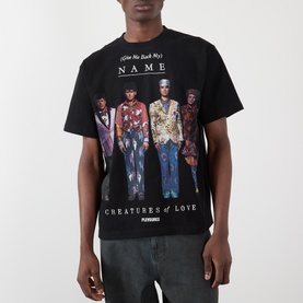 Model wearing Pleasures Creatures of Love Logo Graphic T-Shirt in black with multicolour band graphic and logo print.