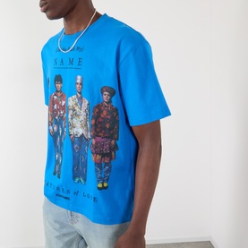Model wearing Pleasures Creatures of Love Logo Graphic T-Shirt in blue with figural print, styled with light wash jeans and chain necklace.