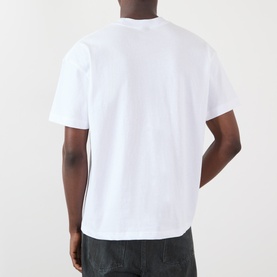 Model wearing Pleasures Immolate Logo Graphic T-Shirt in white, crew neck, short sleeves, straight hem. Back view shown.