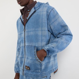 Model wearing Pleasures Logo Check Denim Zip Hoodie in blue, featuring check pattern, zip fastening and split pouch pocket.