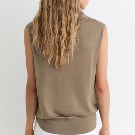 Model wearing Reiss khaki green sleeveless knit top, rear view showing relaxed fit and ribbed hem
