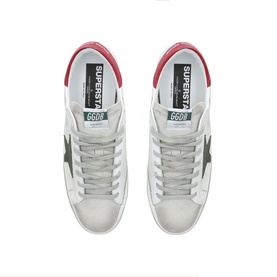 Golden Goose Superstar white leather trainers, overhead view showing dark star detail, grey laces and red heel tab