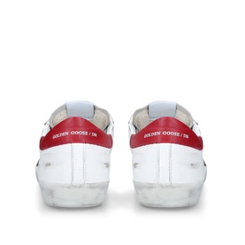 Golden Goose white leather trainers, rear view, red heel tab, clear rubber sole, logo branding visible