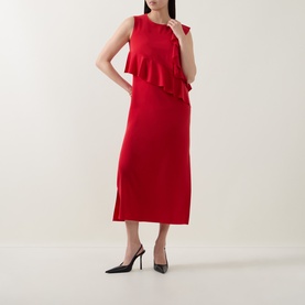 Model wearing Akris Punto red sleeveless midi dress with asymmetric ruffle detail and side slit, styled with black pointed heels