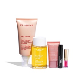 Clarins body care gift set including Body Partner stretch mark cream, Tonic Treatment Oil, a pink tube, and mascara
