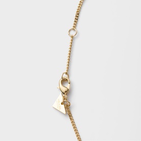 Prada Accessories gold-tone chain necklace clasp detail with lobster closure and branded triangular charm, silver crystal link visible
