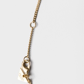 Gold-tone chain necklace with lobster clasp closure and herringbone-style links, detail close-up shot
