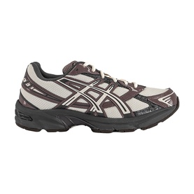 Asics trainer in oatmeal and obsidian grey with silver logo overlays, chunky black rubber sole and lace-up fastening.