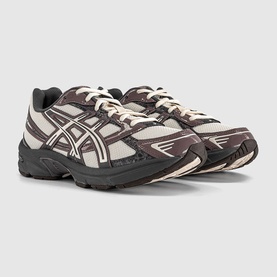 Asics trainers in Oatmeal Obsidian Grey, chunky retro runner silhouette with mesh upper, tonal laces and dark grey rubber sole.