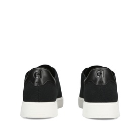 Cole Haan men's black suede sneakers, rear view showing leather heel tab and white sole