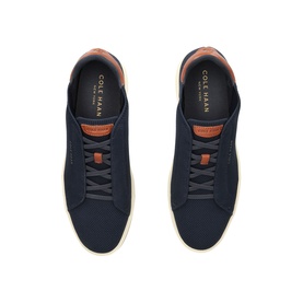 Cole Haan blue leather trainers, overhead view showing navy upper, tan collar trim, matching laces, and off-white sole