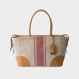 Prada Accessories neutral canvas tote bag with pink stripe detail, tan leather handles, corner panels, and gold triangle logo hardware