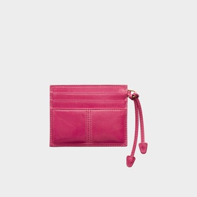 Fuchsia leather card holder with multiple card slots, contrast stitching, and zip puller detail