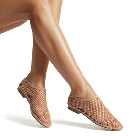 Model wearing Steve Madden white woven mesh flat shoes with pointed toe and flat sole