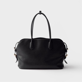 Prada Accessories black leather tote bag with twin top handles, side drawstring ties, and gold-tone hardware, on white background.