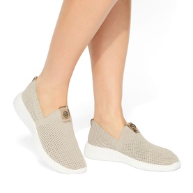 Model wearing Kurt Geiger London gold mesh slip-on trainers with gold-tone logo hardware and white flatform sole