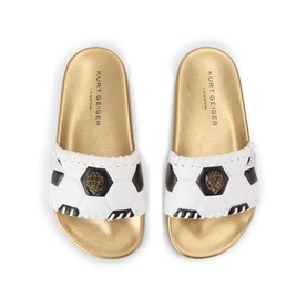 Kurt Geiger London white slider sandals with football print strap and gold footbed, overhead view