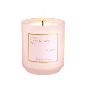 Maison Francis Kurkdjian &Agrave; la rose scented candle in pink frosted glass vessel with gold label, lit flame visible