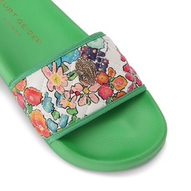 Kurt Geiger London white floral print slide sandals with green sole and embellished eagle hardware detail on strap.