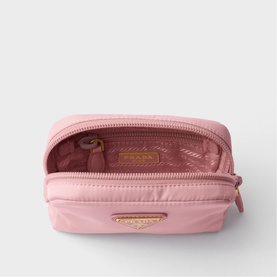 Pink Prada nylon cosmetics pouch, open to reveal pink interior, with gold-tone logo plaque and zip hardware