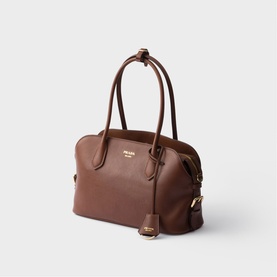 Prada Accessories brown leather bowler bag with double top handles, zip closure, and gold-tone hardware with detachable strap