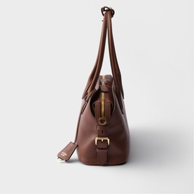 Prada Accessories brown leather tote bag, gold-tone hardware, twin top handles and adjustable buckle strap, side view