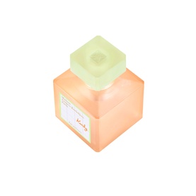 Maison Francis Kurkdjian EDC in a square peach-toned bottle with a mint green cube cap, label detail visible on front.
