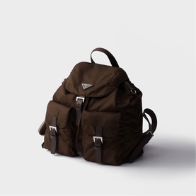 Prada Accessories brown nylon backpack with silver buckle straps, front pockets, and triangle logo plaque