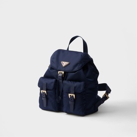 Prada Accessories blue nylon backpack with gold-tone hardware, front buckle pockets, drawstring closure, and top carry handle