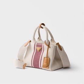 Prada canvas tote bag in cream with pink stripe detail, gold triangle logo, tan leather handles and trim, with detachable shoulder strap