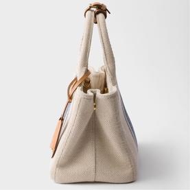 Prada Accessories neutral canvas tote bag, structured silhouette with short handles and gold-tone hardware, side view