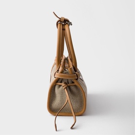 Prada Accessories neutral canvas and tan leather mini bag, silver-tone hardware, dual top handles and drawstring detail, side view