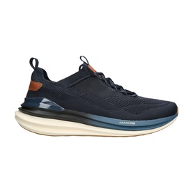Cole Haan blue men's trainer with knit upper, tan leather heel accent, and chunky cream and navy layered sole.