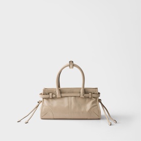 Prada Accessories neutral leather top-handle bag with gold-tone hardware, side drawstring details and structured silhouette