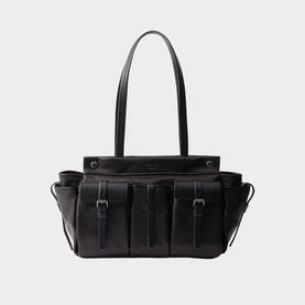 Black leather tote bag with multiple front strap pockets, silver buckle details, and twin top handles on white background