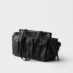 Prada black leather tote bag with front buckle pockets, silver-tone hardware, and dual top handles