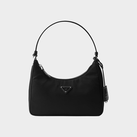 Prada Re-Edition nylon mini bag in black with silver-tone triangle logo hardware and single top handle