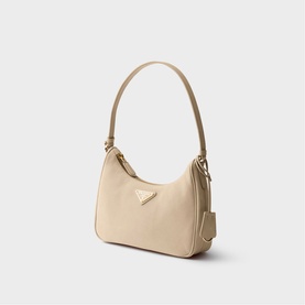 Prada Accessories neutral mini hobo bag with single top handle, gold triangle logo hardware, and detachable strap