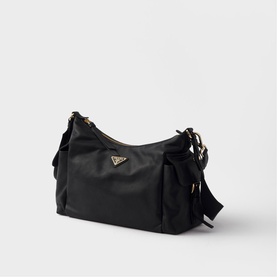 Prada black nylon shoulder bag with gold-tone triangle logo, side ruching detail, and adjustable crossbody strap