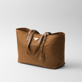 Prada Accessories brown nylon tote bag with dual leather handles, front pocket, and gold-tone triangle logo hardware