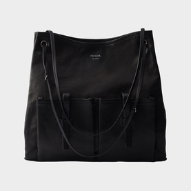 Prada Accessories black large tote bag with dual shoulder straps, front patch pockets, and gunmetal hardware