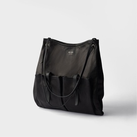 Prada Accessories black tote bag with dual fabric panels, front pockets, and slim shoulder strap, silver-tone hardware