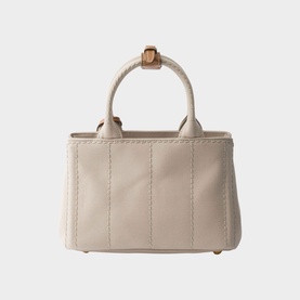 Prada Accessories neutral mini tote bag, structured canvas with vertical topstitching, gold-tone hardware, and short top handles.