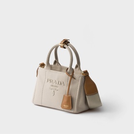 Prada Accessories neutral canvas mini tote bag with gold-tone hardware, dual top handles and detachable shoulder strap