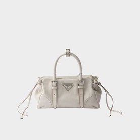 Prada medium leather handbag in white with silver triangle logo, twin top handles, buckle details and drawstring sides