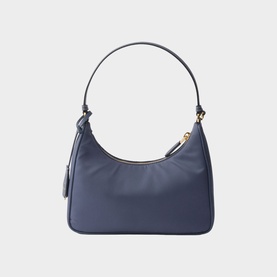 Navy blue shoulder bag with gold-tone hardware, single top handle, zip closure, and small side zip pocket