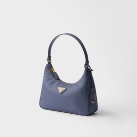 Prada Re-Edition mini nylon hobo bag in slate blue with gold-tone triangle logo hardware and single top handle