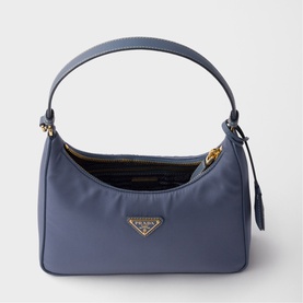 Prada Re-Edition 2000 mini bag in slate blue nylon with gold-tone triangle logo hardware and single top handle
