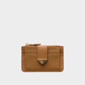 Tan leather card holder with gold zip, triangle logo detail, and multiple card slots