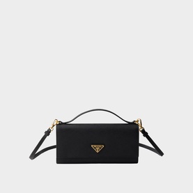 Prada black saffiano leather mini bag with top handle, gold-tone triangle logo, and detachable crossbody strap